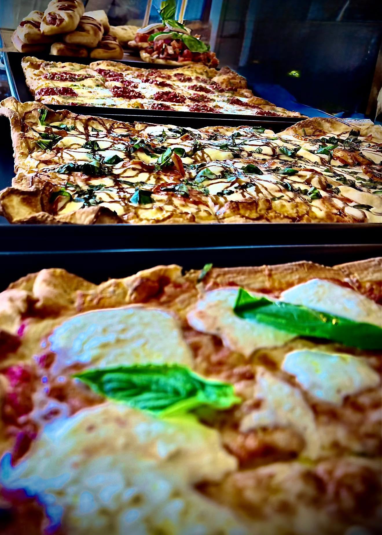Pizza by the slice in the display case